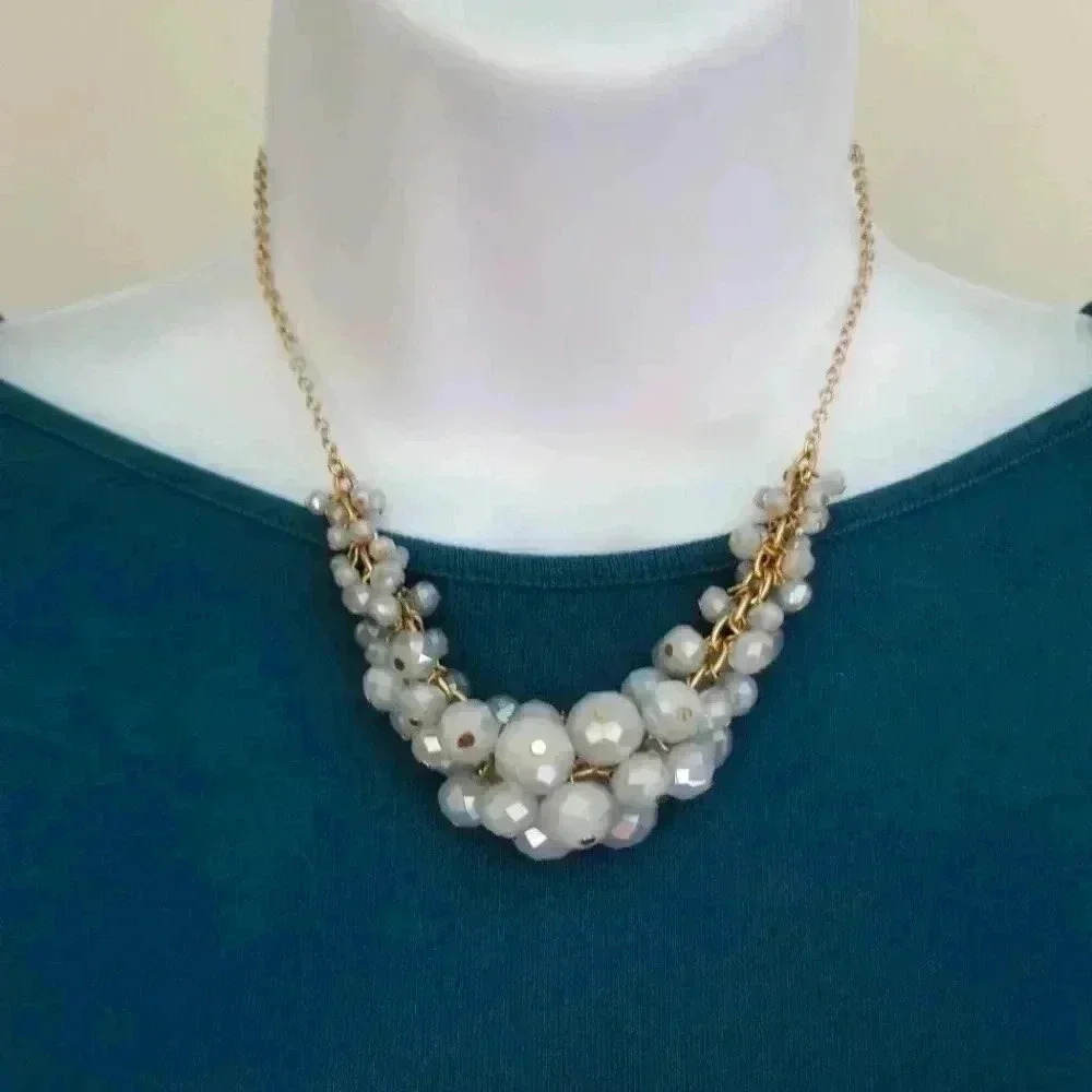 Adjustable gold tone necklace with faceted beads